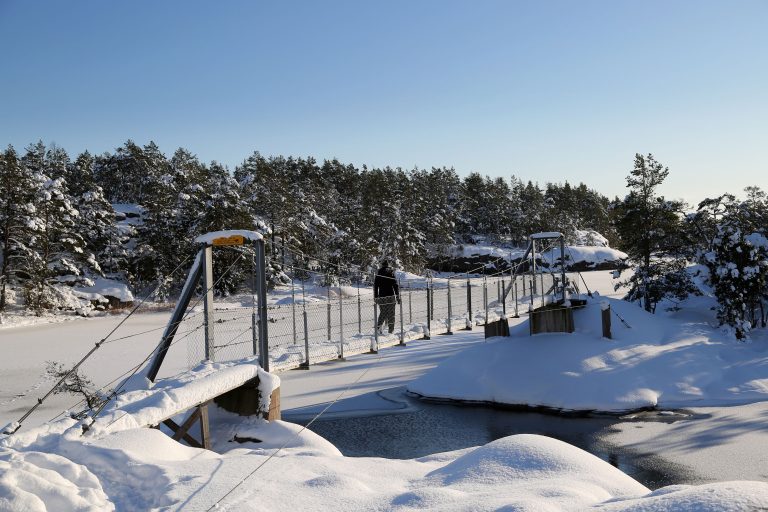 Person walking over bridge at Stendörren nature reserve